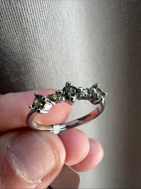 Sterling Silver ring with peridot stones. Size Adjustable